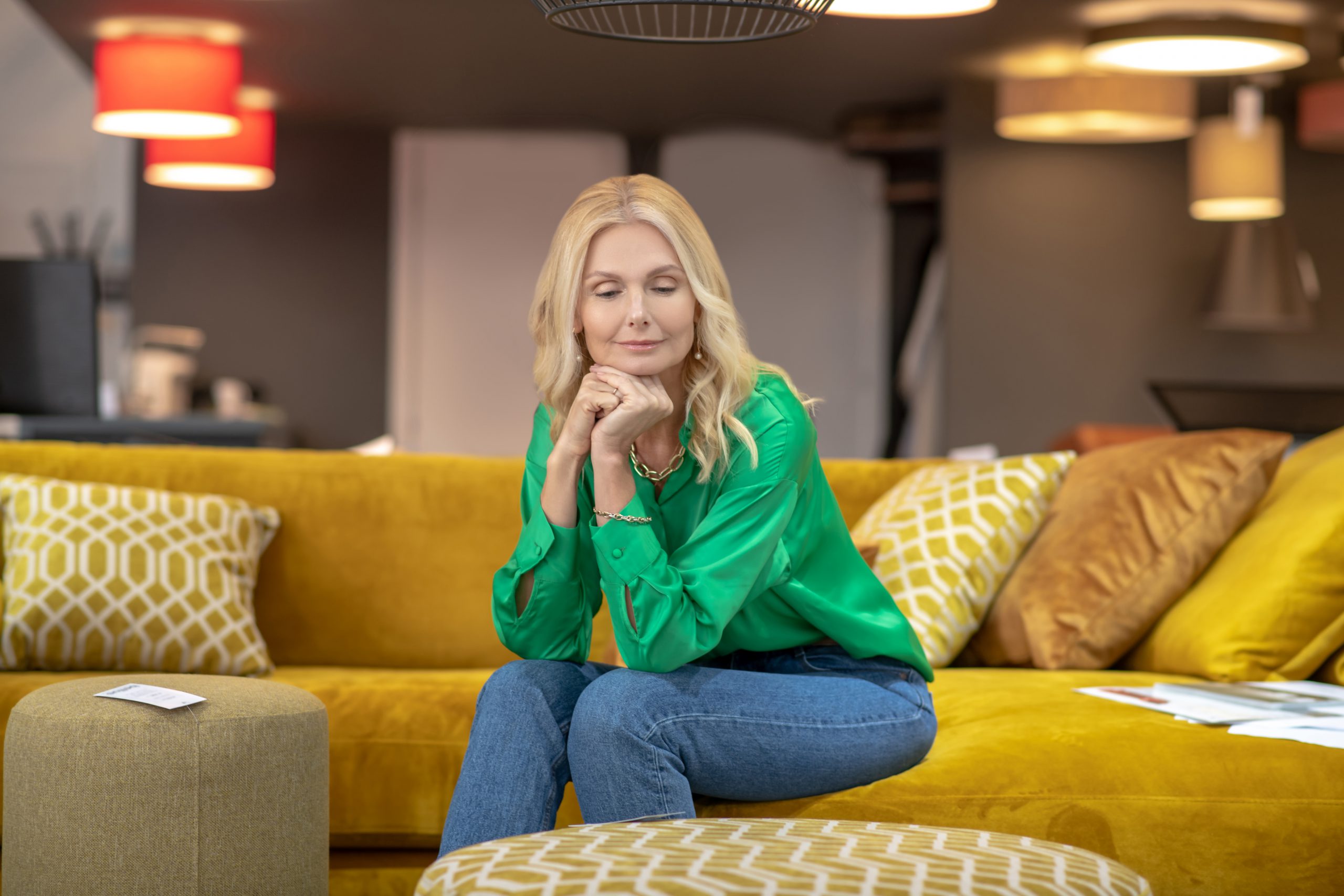Blonde Woman In A Green Blouse Sitting On A Yellow 2021 09 04 11 42 27 Utc