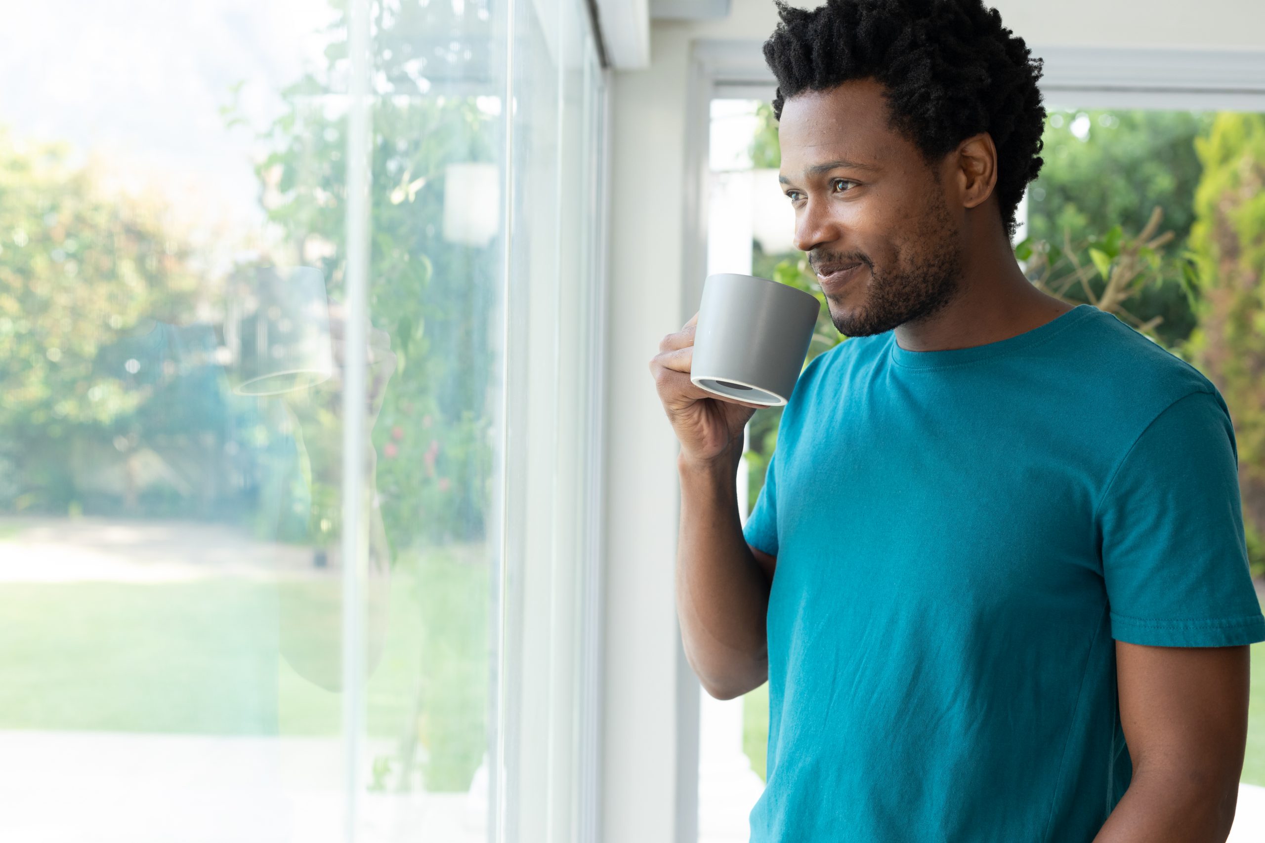 Smiling African American Man Drinking Coffee While 2022 01 31 18 38 24 Utc