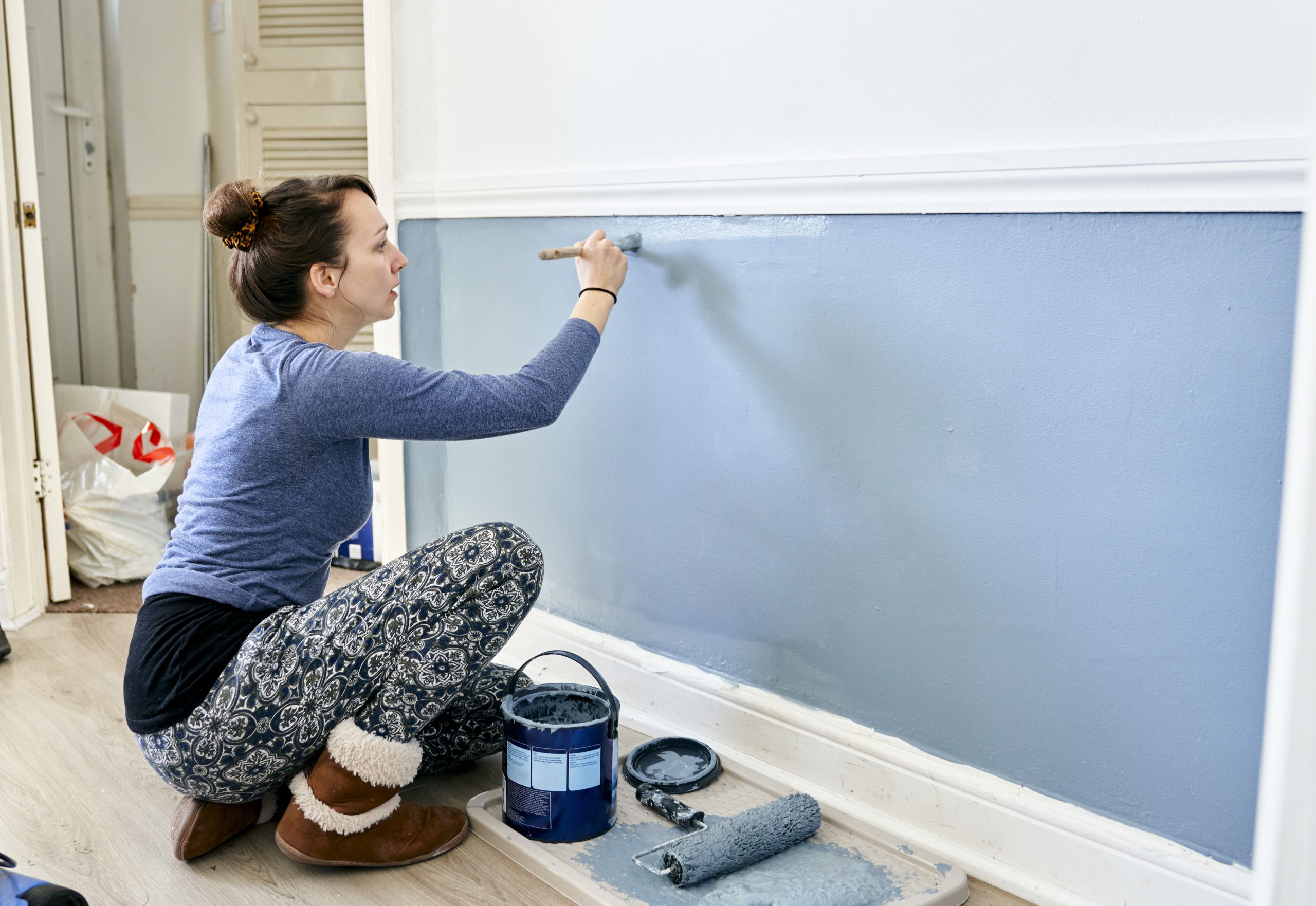 Diy At Home,united Kingdom,woman Painting Wall At Home.
