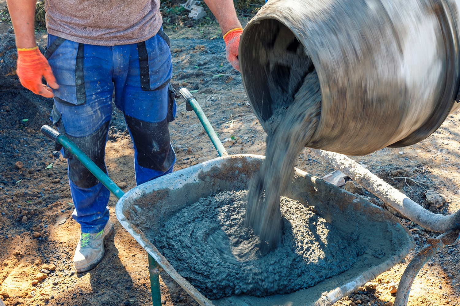 Builder Pouring Cement From A Cement Mixer 2022 12 16 12 36 28 Utc