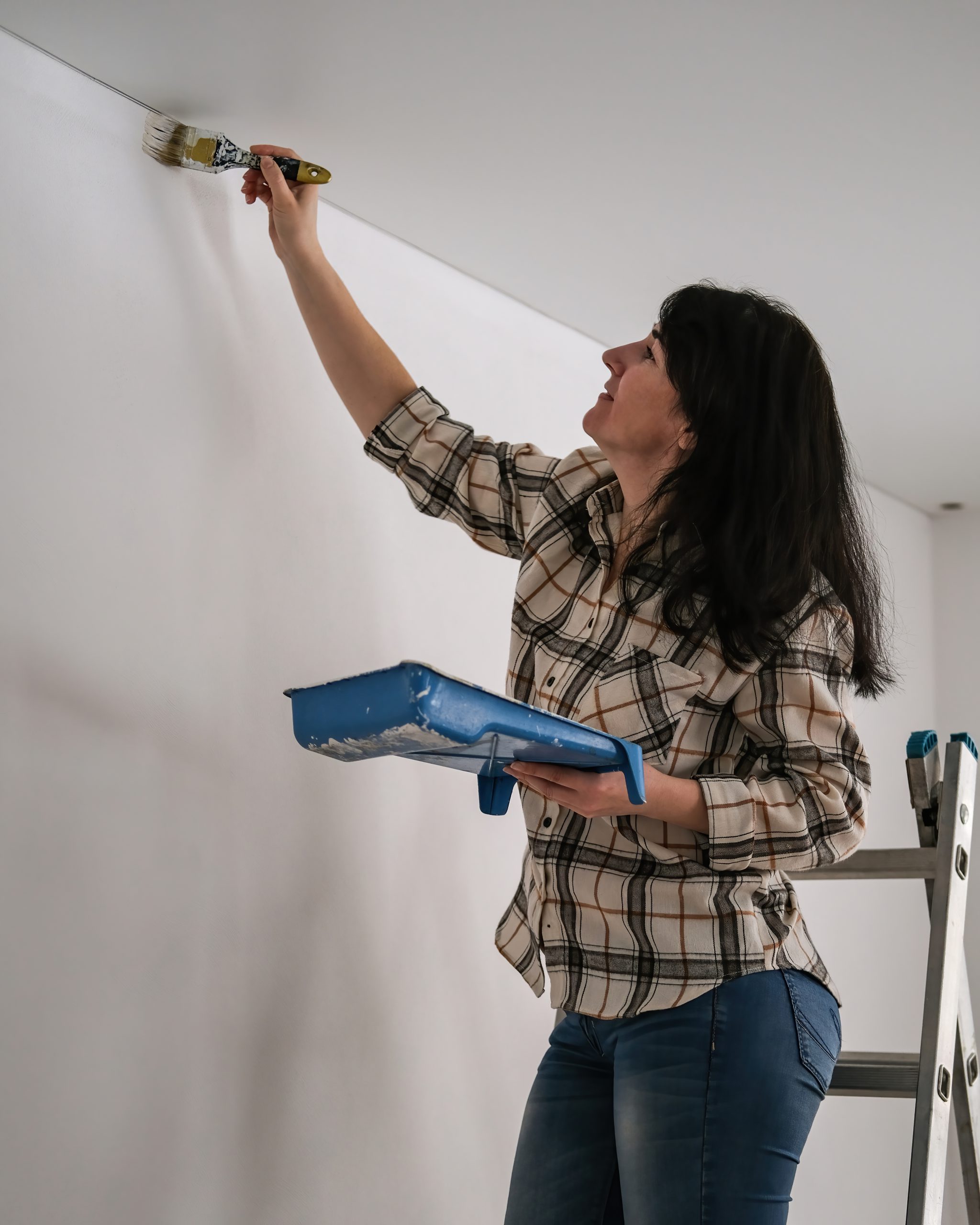 Woman Painting A Wall With White Paint 2023 11 27 04 52 17 Utc
