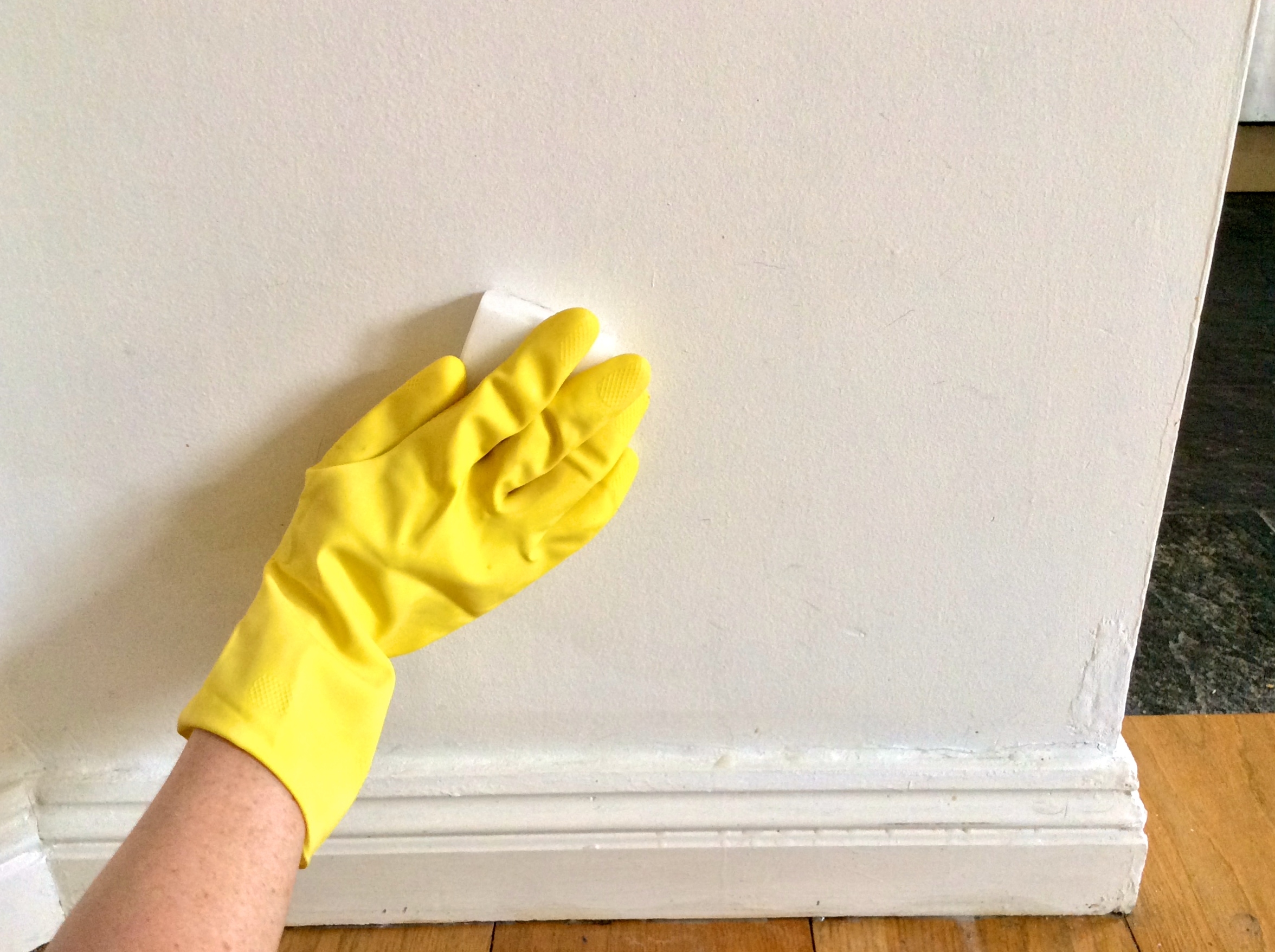 Woman S Hand In Yellow Glove Cleaning White Wall 2023 11 27 04 49 19 Utc