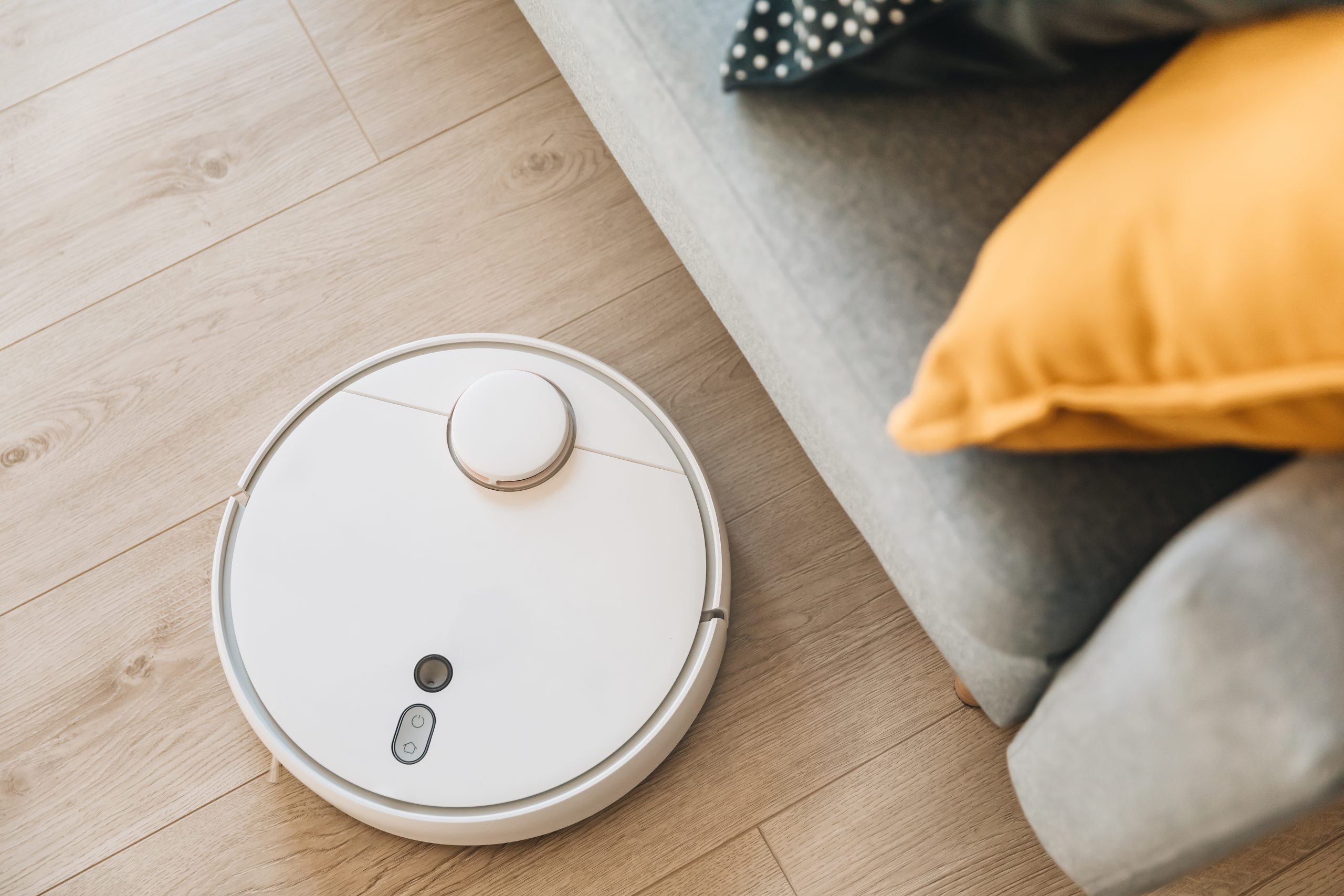 Wireless Robotic Vacuum Cleaner Cleaning A Wooden Floor In Livi