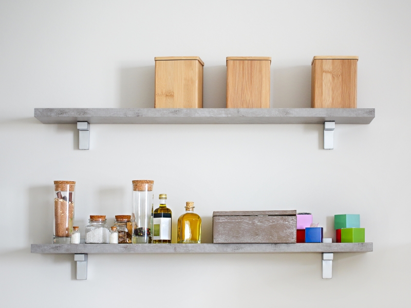 Arranged Jars With Various Spices On Kitchen Shelves